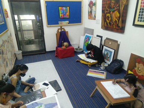 Students drawing in classroom